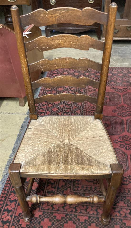 A pair of Lancashire rush seat ladderback chairs